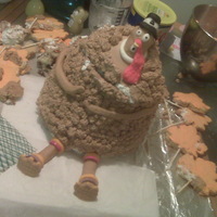 Turkey Cake First cake on my own. I used a regular cake mix out of a box and tried to use sugar cookies as feathers. Good thing I know better now.......