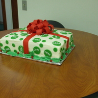 Red And Green Present Cake I did for a luncheon, It was carrot cake with crusting cream cheese frosting. I enjoyed making this cake and love how the bow came out...