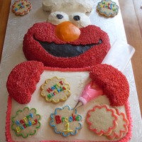 Elmo's The Birthday Baker This was from the Wilton 2009 Book, and was for my Great Niece's first birthday, Her mother did not want any fondant on it as it was...