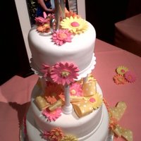 Gerbera Daisies The bride wanted flowers on her cake that matched her bouquet of gerbera daisies. She was very happy with the result!