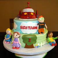 Little Einstein Cake Made for a 2yr old who loved the Little Einsteins. This is my first tiered cake and also my first cake to be covered in MMF. MMF was great...
