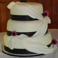 Simple But Elegant French Vanilla and Chocolate cake with Strawberry filling covered in fondant.