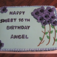 Sweet 16 Birthday Cake This cake was german chocolate with french vanilla butter cream . Covered in light blue fondant with dark purple dogwood flower.