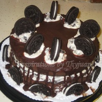 Oreo Cake Chocolate cake with Oreo filling and chocolate ganache topping.
