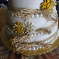 Wedding Country Cakes With /daisy &gerbera&raffia 3 tier fondat,and mmf fondat,buttercream,filling,with strawberry cream cheese