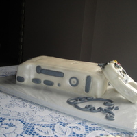 Xbox Grooms Cake This is my first "carved" cake and RKT piece. The cake is chocolate fudge with MMF and the controller is RKT with MMF.