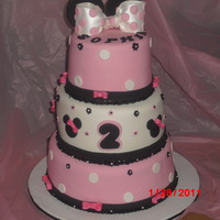 Minnie Mouse Dominican Cake, Bottom tier has Pineapple filling, Middle tier Guava, Top tier Dulce de Leche, wih dominican supiro covered in MMFondant......