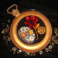 Captured In Time Inspired on an old pocket watch. The golden base is vanilla cake covered with sugarpaste, the cake decorations are made out of gumpaste....