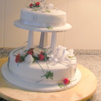 Silver Wedding Cake This cake was for an irish couple (hence the shamrock) and their original wedding cake had red roses on it