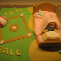 Twin's Birthday Cake My niece loves to read and my nephew loves baseball, so I did a half and half cake. They loved it.