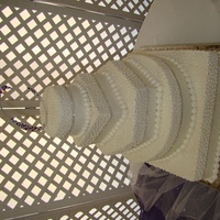 Diamond Cake All buttercream wedding cake. 16 in square, 14 in round, 10 in hexagon, 6 in square, 4in round. Each layer has a ribbon of diamonds around...