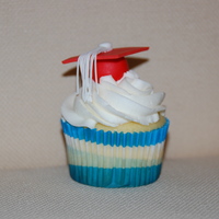 Graduation Cupcake I made these for my daughter's pre-k class for their graduation party. Buttercream with fondant cap.