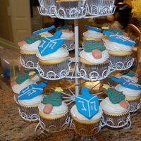 Hanukkah And Christmas Cupcakes Buttercream icing with fondant toppers.