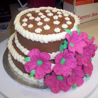 Big Flower Bday Cake Chocolate cake 8", triple-layered with chocolate mousse. 2nd layer 6" same, all covered in a chocolate buttercream. Flowers are...