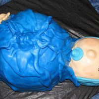 Stork Bag Cake 2-8" rounds with a half soccer ball on top, rkt feet, and small ball for head, covered in MMF