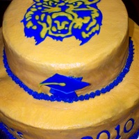 Bobcat Cake Cake is covered in buttercream and design is done with royal icing.