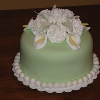 Carnation Cake Final cake for Wilton Fondant and Gum Paste course. Strawberry cake covered in fondant with gum paste carnations and calla lilies.
