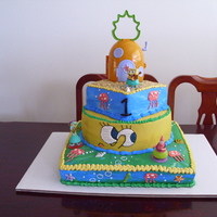 Spongebob Cake 3 Tier cake made with buttercream, Bottom cake is vanilla with bavarian creme, middle is chocolate cake with banana creme and top is Red...