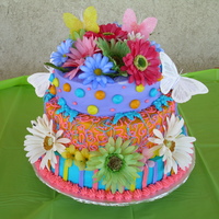 Butterfly And Flower Cake Flowers are artificial