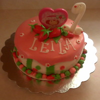 Strawberry Shortcake Red Velvet Cake with Fondant Accents. Topper was a Strawberry Shortcake Compact Mirror.