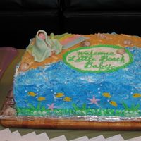 Beach Baby Shower Cake Niece wanted a beach-themed shower cake. Made baby and blanket and fish from fondant. Rest is buttercream.
