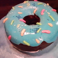 Giant Chocolate Donut With Blue Frosting My nephew was turning 4, and wanted me to make his cake. I asked him what he wanted...I told him he could have anything he wanted. He chose...