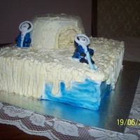 Eskimo For an eskimo themed sweet 16 party. Vanilla sponge cake with vanilla b/c. The water on the side is blue lustre brushed onto fondant.
