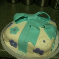 Gift Cake Wilton Course cake, fondant covered, fondant bow & flower cut outs.
