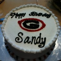 Uga "g" Cake 8X3" round cake iced with decorators buttercream. Shell border. "G" outline and filled in with piped stars.