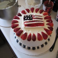 4Th Of July Cake a red white and blue cake with whipped cream frosting and fruit
