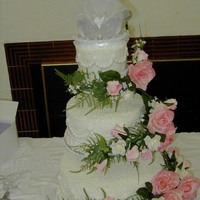Youngest Son's Wedding Cake This cake is all butter cream with beads and silk flowers. I think the flowers kinda over powered it, But I think it still turned out...