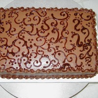 Dad's 70Th All chocolate cake, chocolate bavairian cream filling and the scaroles are done in chocolate syrup.