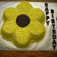 Sun Flower Use Wilton Daisy Pan for the cake. For the center I used the pan for a form and candy melts.