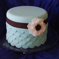 Blue Scalloped Cake This is a Tiffany Blue cake with a layered scalloped design with a anemone flower to finish. Thanks for looking