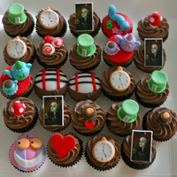 Alice In Wonderland Cupcakes Chocolate Cupcakes with all Fondant Alice in Wonderland decorations.