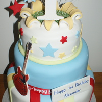 Rock N' Roll Number 1 Special Cake for a First Birthday - the theme was Rock n' Roll hence the guitar and microphone. This was the heaviest cake I have made...
