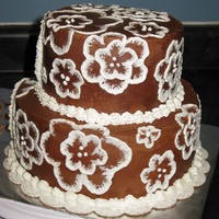 Brush Embroidery On Chocolate Buttercream This was a birthday cake for a young girl who wanted her Karate club logo and Air Cadet squadron crest on a very "lacey and feminine&...