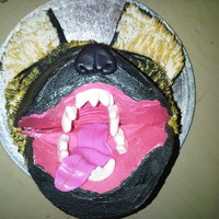 Hyena Cake Made with chocolate and strawberry round cakes with blackberry swiss meringue buttercream filling and decorator's buttercream icing....