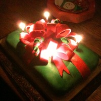 Christmas Present A 13x9 cake covered and fondant. Then I shaped the fondant into the bow and ribbon on top of the cake.