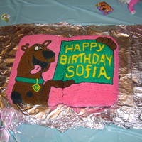 Scooby Doo This cake is 2 13x9 cakes put together...I really needed a bigger cake pan, so unfortunately when I moved it the cakes split a bit. But it...