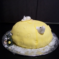 Cheese Cake Yellow/Strawberry filling marshmallow fondant covered. Fondant mice. I surprised my friend with this cake. She wanted a an actual Cheese...