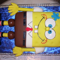 Full Sheet Hand Sculpted Sponge Bob Cake This is a full size sheet cake, cut in half and stacked in white cake with raspberry filling, buttercream icing and Satin Ice. The shoes...