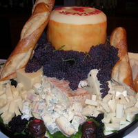 Wheel Of Emantal Swiss Cheese This is a huckleberry champagne cake with fresh hucklberry filling. The bride and groom had an eight hour wine and cheese tasting wedding...