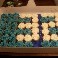 Graduation Cupcakes Graduate's basketball jersey number was "32". School colors were blue and gold. I used Drop flowers and blue glitter on blue...