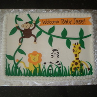 Safari Shower Cake this is a sheet cake (gasp!) iced in buttercream with fondant decorations.