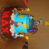Toy Story Birthday Cake The figures are from the Disney Store. Stars, "2", "Max" and picket fence are fondant. Everything else is buttercream...