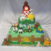 Farm Theme Cake This is a farm theme cake for a 2 year old boy. The animals are all made out of fondant and the barn is rice krispy treats covered in...