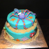 Sealife Cake Two tiered yellow buuter cake with buttercream icing and fondant/gumpaste accents, Sand made from crumbled cookies.