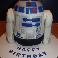 R2D2 Thnaks to everyone on CC for all the ideas for this cake. Yellow cake covered in MMF. Legs are RKT covered in MMF.