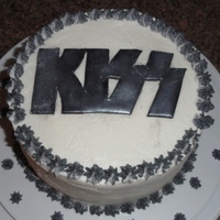 Kiss Cake This cake is for my bf's dad. He is a Kiss fanatic. He dresses up as Gene Simmons for Halloween and concerts :) The cake is a version...